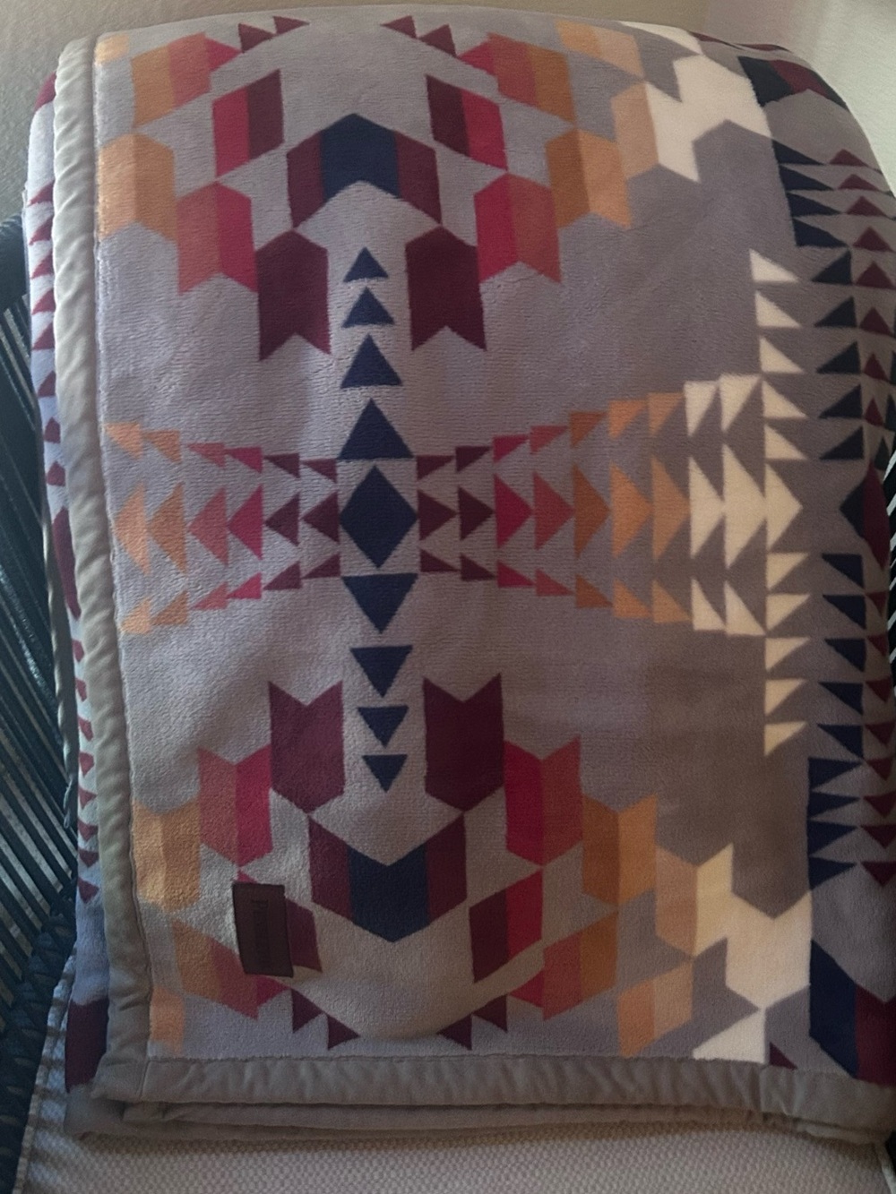 Pendleton Reversible Plush Throw in the Legend Lake Grey pattern.